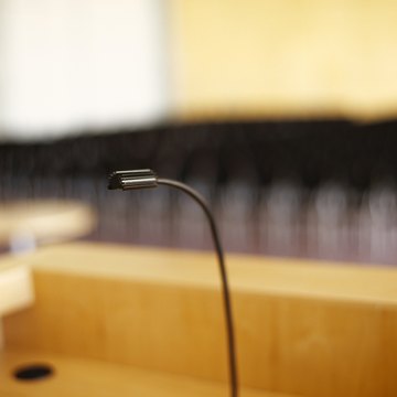 Ask the recipient to come forward and join you at the podium.