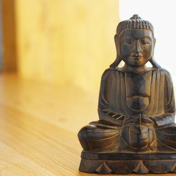A statue often depicts a seated Buddha.