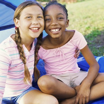 Before a girl starts on a service project, she must earn two badges that count toward the service award.