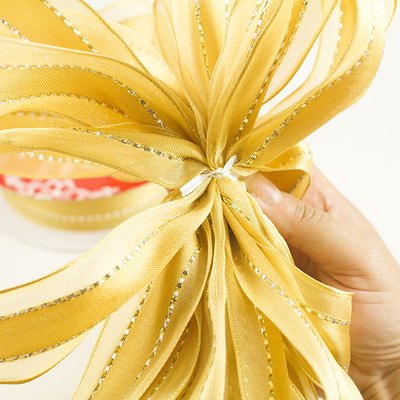 How to Make Decorative Big Yellow Ribbon Bows | eHow