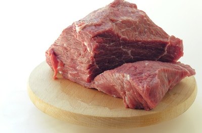 beef meat image by Maria Brzostowska from Fotolia.com Protein is an important ingredient in every dog's diet.