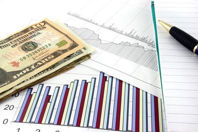 business charts with us money image by Andrew Brown from Fotolia.com Choose between money and capital markets to grow your nest egg.