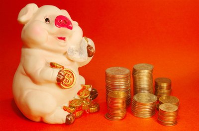 money image by Yury Shirokov from Fotolia.com Paying off debt can ultimately save a lot in interest charges.