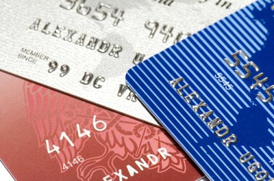 three credit cards image by Aleksandr Ugorenkov from Fotolia.com Stick to a budget to get credit card debt paid off.