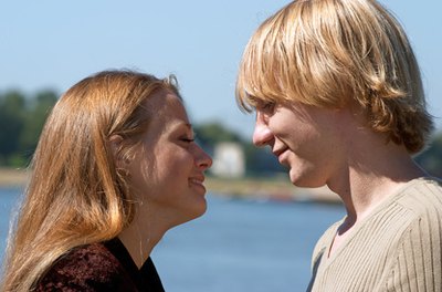 young couple image by Igor Zhorov from Fotolia.com You can maintain separate bank accounts or merge them.
