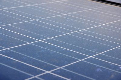 Solar Panel image by kuhar from Fotolia.com Solar panels absorb electromagnetic radiation and convert it into electricity.