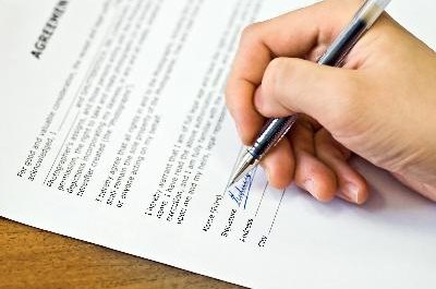 sign agreement image by PaulPaladin from Fotolia.com Written adoption agreements effectively establish legal ownership rights to a dog.