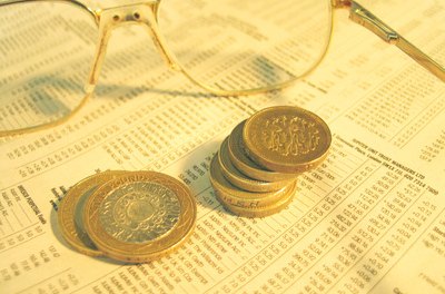 stocks and shares image by Fyerne from Fotolia.com ETFs combine the advantages of stocks and mutual funds.