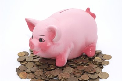 piggy bank image by pershing from Fotolia.com Saving money early secures your financial future.