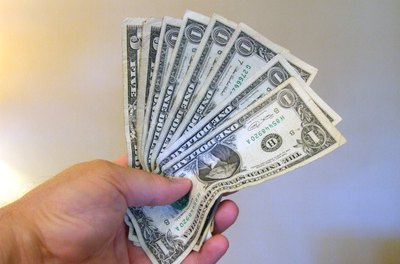 Cash image by Greg Carpenter from Fotolia.com Money market accounts are bank accounts that offer higher interest rates in return for a higher minimum investment than traditional savings accounts.