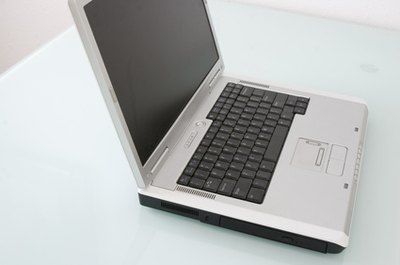 notebook computer image by Lisa Eastman from Fotolia.com Plug your computer into a power strip to save on your utility bill.