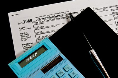 TAX TIME image by brelsbil from Fotolia.com Find out whether you qualify to file as head of household.