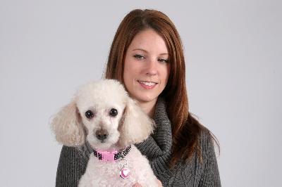 Pretty woman smiling with her poodle pet image by Allen Penton from Fotolia.com Brushing is a good time to inspect your pup's coat and skin.