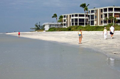 people on beach image by palms from Fotolia.com Early 401(k) participation will help to ensure your beachfront retirement plans.