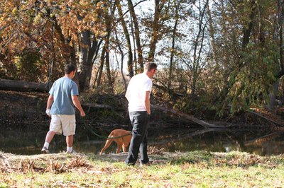 walking the dog image by Wendi Evans from Fotolia.com Canine jealousy stems from pack instincts.