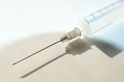 vaccine image by Mykola Velychko from Fotolia.com Vaccinations provide critical protections for pets.