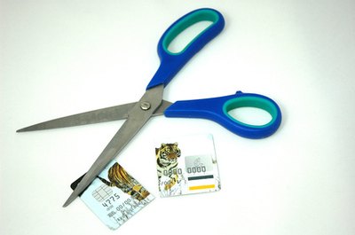 scissors and credit card cut in two image by Warren Millar from Fotolia.com Canceling a credit card could actually hurt your credit score.