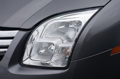 Headlight on new car image by steven Husk from Fotolia.com Get coverage for your new car to protect its value.
