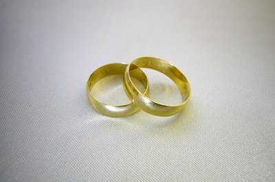Wedding rings over white image by kaleff from Fotolia.com Your new marriage is also a financial union, and your commitment to your finances is also a commitment to your relationship.