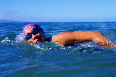 Thinkstock/Comstock/Getty Images A one-mile swim builds endurance and tones your whole body.