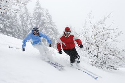 Jupiterimages/Comstock/Getty Images Strong knees help you control direction changes and precision movements while snow skiing.