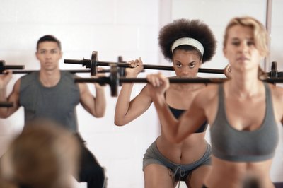 Comstock Images/Comstock/Getty Images Squats are a thigh and butt blaster.