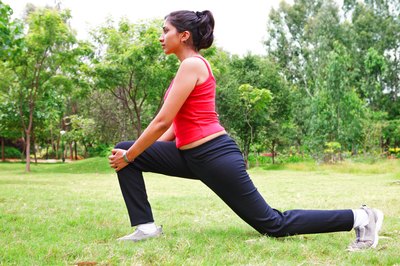 Visage/Stockbyte/Getty Images Bending forward opens the hip and lengthens the hip flexors.