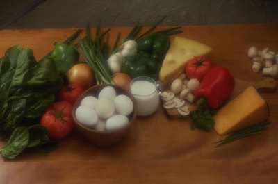 Jupiterimages/Comstock/Getty Images Eggs, cheese and other high-protein foods contain phenylalanine.