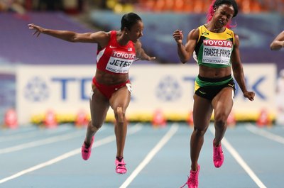 Mark Kolbe/Getty Images Sport/Getty Images Shelly-Ann Fraser-Pryce edges Carmelita Jeter in the women's 100 meters in Moscow in 2013.