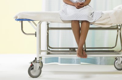 Siri Stafford/Photodisc/Getty Images Insurance payouts for hospital expenses are not taxable income.