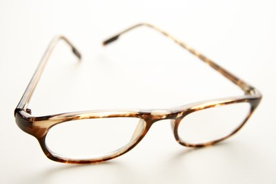 BananaStock/BananaStock/Getty Images Optometric assistants help patients to select frames that are flattering and comfortable.