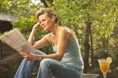 Comstock Images/Comstock/Getty Images Publicists use newspapers to publicize their client's accomplishments.