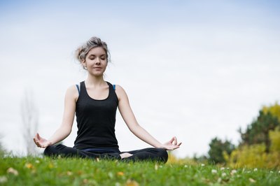 Jupiterimages/Photos.com/Getty Images The spiritual aspects of yoga emphasize meditation.