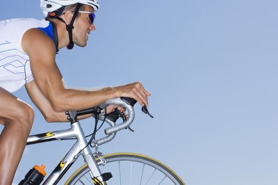 Polka Dot Images/Polka Dot/Getty Images Warming oil can increase your speed by fighting muscle fatigue during long-distance cycling.