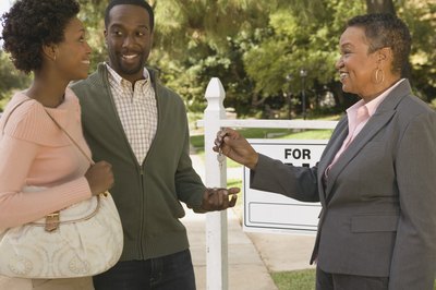 Brand X Pictures/Brand X Pictures/Getty Images You don't get the keys until after you've paid the closing costs.