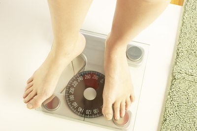 Hemera Technologies/AbleStock.com/Getty Images Losing weight is the only secret to a slimmer waist, butt and neck.