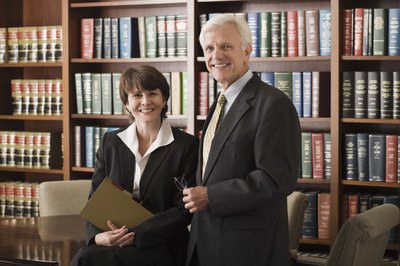 Jupiterimages/Comstock/Getty Images Self-employed criminal lawyers build their practices and their incomes over time.