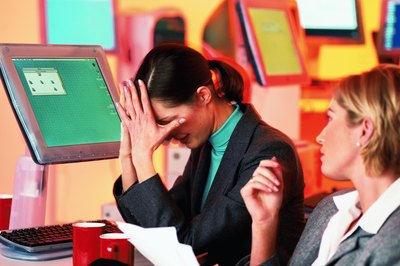 Stockbyte/Stockbyte/Getty Images Pushing yourself to be perfect at work can cause anxiety, dysfunction and miscommunication.
