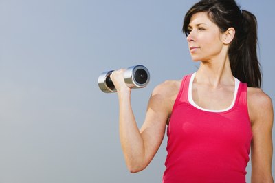 Brand X Pictures/Brand X Pictures/Getty Images Don't neglect dumbbells in your fat loss plan.