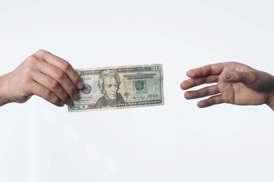 Jupiterimages/Comstock/Getty Images Trading in your old car is one way to use its value.