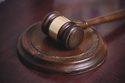 NA/Photos.com/Getty Images A person can be guilty of illegal insider trading for providing an insider stock tip to another person.