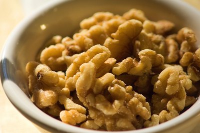 Jupiterimages/Photos.com/Getty Images Walnuts contain potassium and are rich in omega-3 fatty acids.