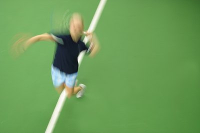 Hemera Technologies/AbleStock.com/Getty Images Tennis players use their muscles in short, powerful bursts of energy.