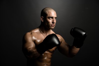Jupiterimages/Photos.com/Getty Images Shadowboxing can be an excellent way to lose weight.