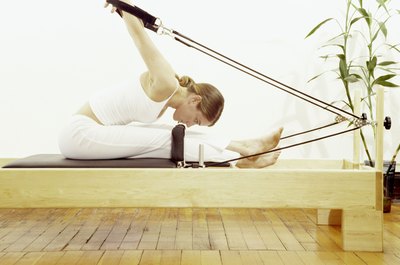 Brand X Pictures/Brand X Pictures/Getty Images Pilates reformers feature springs to create resistance.