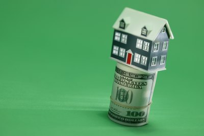 Comstock Images/Comstock/Getty Images The market value of your house is influenced by the economy and by housing demand in your area.