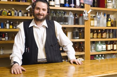 Jupiterimages/Comstock/Getty Images Many Hasidic Jews take retail jobs.