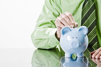 Jupiterimages/Photos.com/Getty Images Create a savings budget by analyzing your expenses and paying yourself first.