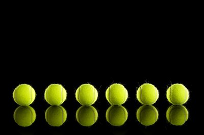 Thomas Northcut/Lifesize/Getty Images Dribbling a tennis ball can greatly improve your ball handling skills.