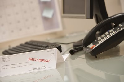 Comstock Images/Comstock/Getty Images Garnishment allows you to take a portion of the debtor's paycheck until the debt is repaid.